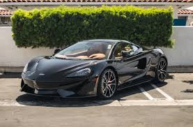 2017 Mclaren 570gt Onyx Black With Saddle Nappa Leather The List Of Options Include The Factory Sports Exhaust With The Stealth E Mclaren Super Cars Dream Cars