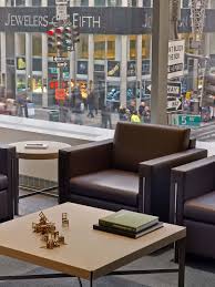 Gkv Architects Bank Leumi Usa Headquarters Located On Fifth Avenue The 5 Story Headquarters For Bank Leum Commercial Interiors Architect Stone Feature Wall