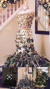 A Glam Christmas Tree With Bronze Leaves Dress Form Christmas Tree Christmas Tree Dress Mannequin Christmas Tree
