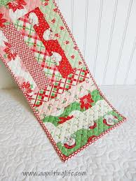 Swell Christmas Table Runner Project A Quilting Life Quilted Table Runners Christmas Table Runner Pattern Christmas Table Toppers