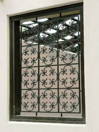Wrought Iron Screen In Fleur De Lis Pattern Window Grill Design Iron Window Grill Window Grill
