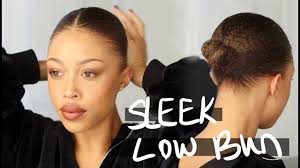 Sleek Low Bun On Natural Hair Relaxing Video Natural Hair Bun Styles Natural Hair Styles Black Hair Bun