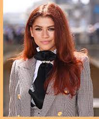 Fashionable young woman in black leather clothes and with colored hair. Red Hair Colour On Black Women Is Huge Celeb Trend 2019
