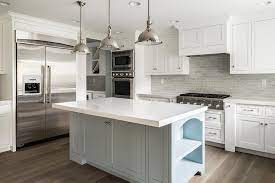 white kitchen cabinets with gray brick