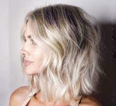 Short blonde hair having a wavy touch on side styled with slight layers on front. 22 Best Short Blonde Hairstyles That Are Trending