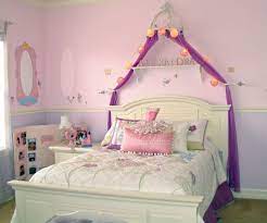 This room's blue ceiling, as well as small pops of powder blues, lavender, and bright coral, breaks up a mostly pink color scheme. Girl S Princess Themed Bedroom Kids Room Decorating Ideas Dot Com Women
