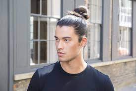 Tuck the end of the braid under the bun, then wrap another hair tie around the base of the bun. 4 Quick And Easy Ways To Tie A Man Bun At Home All Things Hair Uk