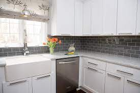 white kitchen cabinets with gray subway