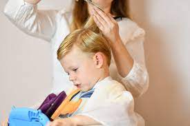 Senior businessman with hair gel in front of mirror. Children S Hairdresser Kids Hair Salon In Chelsea London