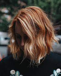 Lighter blonde highlights give an illusion of fullness on a short pixie haircut, while also providing dimension to the reddish base. These Natural Looking Highlights Are The Easiest Way To Refresh Red Hair Allure