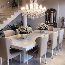 Sleek White Table With Ivory Beige Dining Chairs Top Off The Sophisticated Look With A Gorgeous Chandelie Elegant Dining Room Luxury Dining Room Luxury Dining