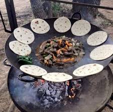 Discada Or Cowboy Cooker Made From Plow Discs With The Center Hole Welded Closed And Horse Shoes Welded On Outdoor Cooking Camping Meals Camping Hacks Food