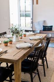 Dining Area With Natural Farmhouse Table And Black Windsor Style Dining Chairs Natural Dining Room Dining Farmhouse Dining Room