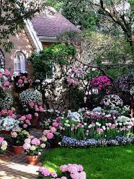 Beautiful Home With A Gardening Showing Pink Hydrangeas And Pink And White Tulips Beautiful Gardens Garden Inspiration Cottage Garden
