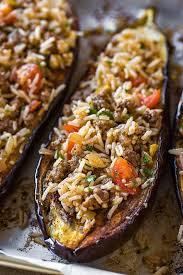 Stuffed Eggplant With Garlic Tahini Sauce The Cozy Apron Recipe Recipes Food Healthy Recipes