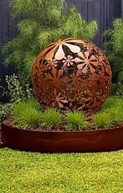 Flower Ball Sculpture Flower Ball Sculpture Sitting Pretty In Corten Garden Edging Landsca Metal Sculptures Garden Garden Art Sculptures Steel Garden Edging
