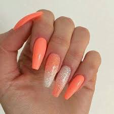 Long and short coffin nails, aka ballerina nails, are a popular shape among the ladies who like to attract attention with the help of their extraordinary outlooks. Pretty Coral Coffin Shaped With Just A Hint Of Silver And Gold Glitter To Accent Orange Acrylic Nails Holiday Acrylic Nails Coral Nails
