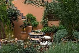 Small Mediterranean Garden With Potted Planters Courtyard Mediterranean Garden Mediterranean Garden Mediterranean Garden Design Outdoor Planters
