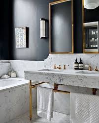 Lovely Bathroom With Marble Black Contrast Wall And Deep Gold Love It From House And Garden Ma Marble Bathroom Designs White Bathroom Designs Chic Bathrooms