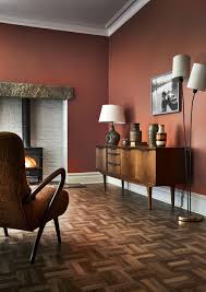 16 Dark Interior Design Ideas To Embrace This Winter Orange Living Room Walls Living Room Orange Burnt Orange Living Room
