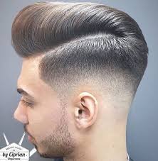 This cut is slick, it's soothing and will go best with monochromatic outfits. A Mid Fade With A Large Pompadour Fade Haircut Mens Haircuts Fade Mid Fade Haircut