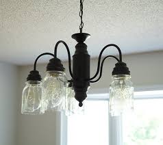 Spray Paint Mason Jar Chandelier Update Diy Mason Jar Lights Mason Jar Chandelier Jar Chandelier