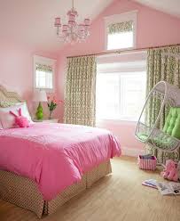 When it comes to having the perfect night's sleep, creating be inspired by these bedroom ideas designed to get you out of bed in the morning and ready to face the day. Green And Pink Girls Bedroom With White Rattan Hanging Chair Contemporary Girl S Roo Girls Bedroom Colors Girls Bedroom Paint Colors Pink Bedroom For Girls