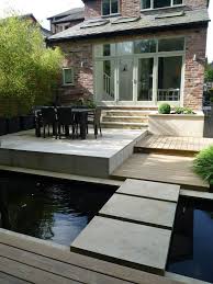A Contemporary Garden For A Victorian Semi Detached House Using Contemporary Sawn Sandston Contemporary Garden Courtyard Gardens Design Outdoor Gardens Design