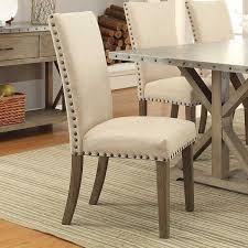 A Sophisticated Take On Industrial Chic Style This Must Have Side Chair Showcases Tan Upholstery Fabric Dining Chairs Upholstered Dining Chairs Dining Chairs