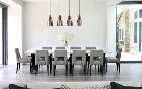 Modern Pendants Low Back Chairs Hardwood Floors Oversized Windows Floral Centerpiec Dining Room Design Modern Interior Design Dining Room Dining Room Interiors