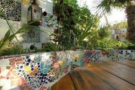 Use Pieces Of Old Plates And Tiles To Create A Beautiful Mosaic Pattern On A Retaining Wall Mosaic Garden Mosaic Garden Art London Garden