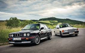 Two White And Black Sedans Bmw E30 Car Mercedes Benz 190e Bmw M3 E30 720p Wallpaper Hdwallpaper Desktop Bmw Mercedes Benz 190e Bmw E30