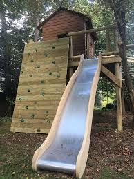 No Matter What Garden Or What Build These Stainless Steel Slides With Wooden Hand Rails Look Great Wooden Tree House Tree House Kids Tree House