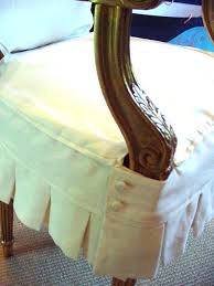 This Dining Chair With Arms Has A Monogram And A Box Pleated Skirt Box Pleats Spaced Slipcovers For Chairs Dining Room Chair Covers Dining Chair Slipcovers