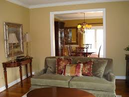 Sw Restrained Gold Paint Color For Living Room Would Go With Our Olive Green Couch Blue Living Room Decor Gold Living Room Decor Living Room Colors