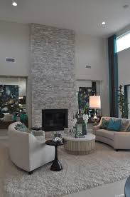 For This Space The Focal Point Is The Fireplace It Is Tall And Bold Helping The Room Feel Taller It Also Living Room With Fireplace Living Room Designs Home