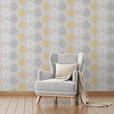 The Wallpaper Features A Fun Tree Design On A Shimmering Metallic Background And Wil Grey And Yellow Living Room Yellow Living Room Best Living Room Wallpaper