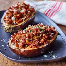 An Eggplant Is The Perfect Bowl For This Savory Dish The Turkey Stuffed Baked Eggplant Is A Flavor Explosion Packed Wit Recipes Baked Eggplant Turkey Recipes