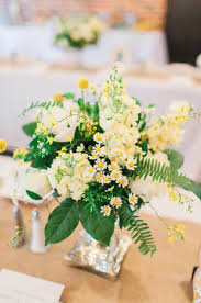 Farm Table Centerpiece Arrangement Of Pale Yellow Stock Cream Roses White Roses Billy Ball Yellow Wedding Flowers Flower Centerpieces Wedding Wedding Leaves