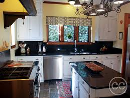 Painted cabinets and knotty pine floor in the kitchen. Classic Cupboards Paint 11 1930 S Knotty Pine Cabinets Painted White