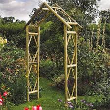 The Process Of Adorning Your Garden With Wooden Garden Arches Decorifusta Garden Archway Garden Arches Rustic Gardens