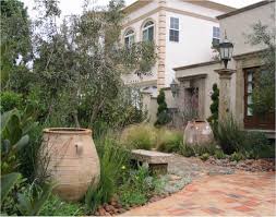 Modern Mediterranean Outdoor Designs With Large Terracotta Planters That Are Used As Mediterranean Garden Design Mediterranean Landscaping Mediterranean Garden