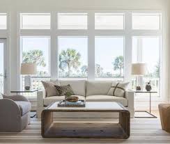 Let There Be Light Though Relatively Modest On Square Footage The Wide O Window Treatments Living Room Large Windows Living Room Living Room Lighting Design