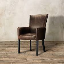 Featuring Rustic Top Grain Leather The Arhaus Aiden Leather Dining Arm Chair In Brown Leather Dining Arm Chairs Dining Arm Chair Leather Dining Room Chairs