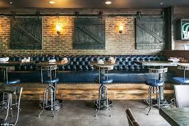 In Irvine In America Bosscat Kitchen Libations Has A More Down To Earth Feel The Restaur Restaurant Booth Seating Restaurant Seating Bar Design Restaurant