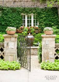 Boston Ivy Provides A Lush Backdrop For The Private Courtyard Of This Buckhead Garden Designed By Alex Smith Garden Front Courtyard Beautiful Gardens