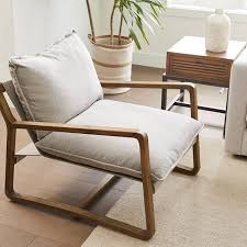 Low Slung Pillow Cushioning Made For Long Term Lounging The Simcoe Chair S Sculpted Arms And Cozy Curves Create A Welcoming Seat Rig Urban Barn Chair Seating