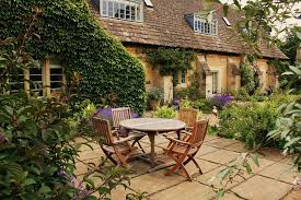 Cottage Garden Patio Ideas Complete With Wooden Patio Tables And Folding Chairs In The Backyard O Cottage Garden Patio English Cottage Garden Patio Landscaping