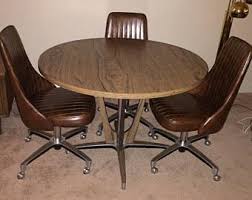Chromcraft Dining Room Table And Swivel Bucket Chairs With Casters Polished Aluminum Base With Wood Grain Acce Vintage Dining Chairs Bucket Chairs Kitchen Sets