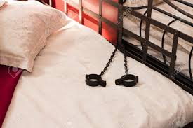 She gets undressed and gets into bed. A Metal Bed With Handcuffs Locked Onto It Stock Photo Picture And Royalty Free Image Image 5729245
